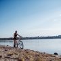 woman on a bicycle in beach